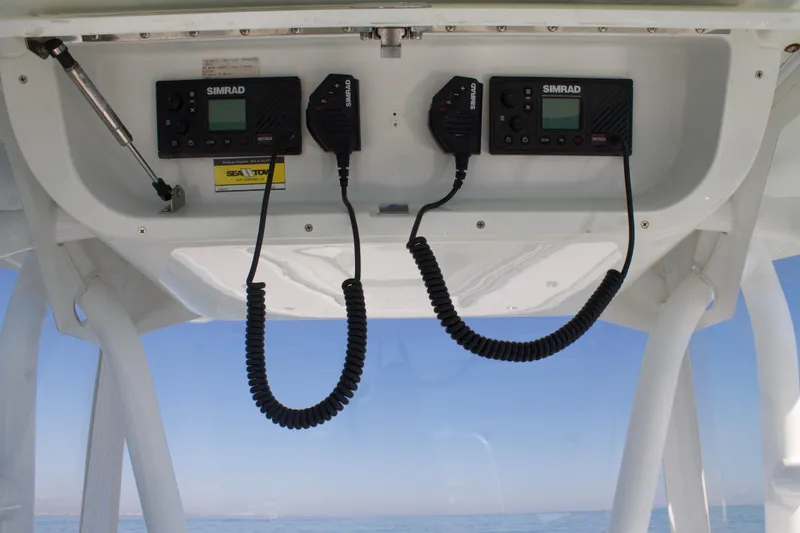 Slide: The Image of 2014 Yellowfin 32 Offshore boat electronics with Simrad communication devices. - 25