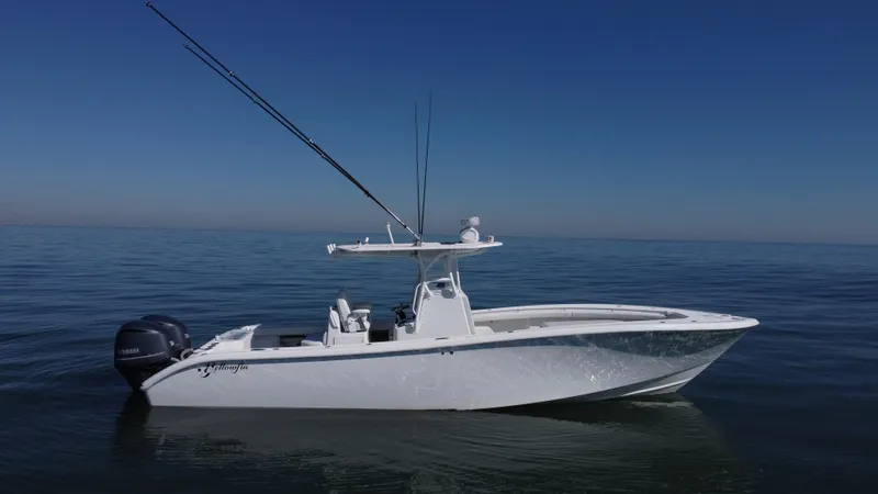 Slide: The Image of 2014 Yellowfin 32 Offshore boat on calm ocean waters. - 3