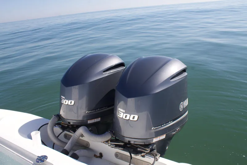 Slide: The Image of Twin Yamaha 300 engines on a 2014 Yellowfin 32 Offshore boat in open water. - 41