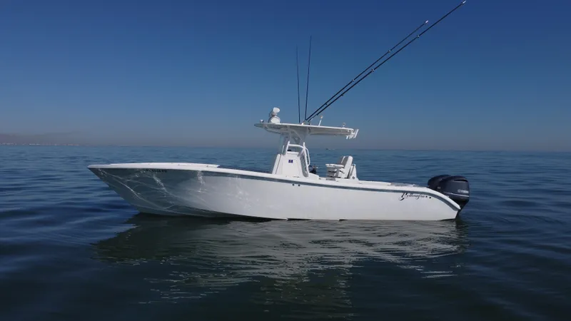 Slide: The Image of 2014 Yellowfin 32 Offshore boat on calm ocean waters. - 6