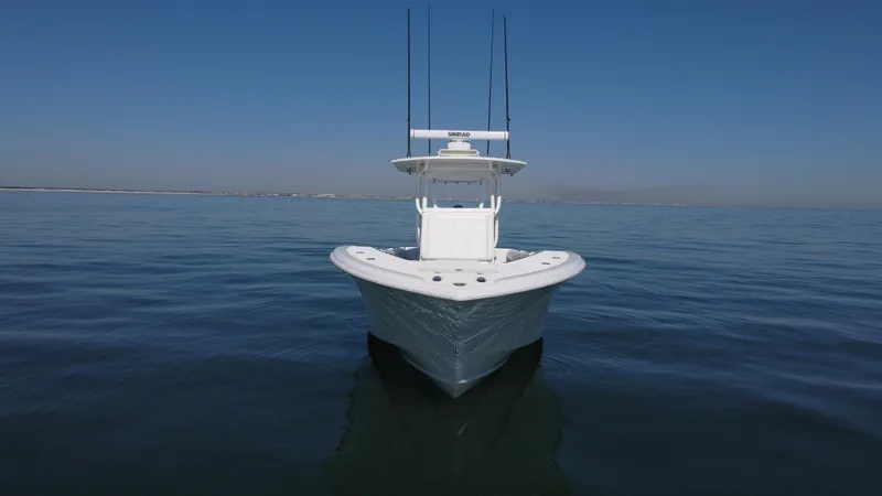 Slide: The Image of 2014 Yellowfin 32 Offshore boat on calm ocean waters. - 9