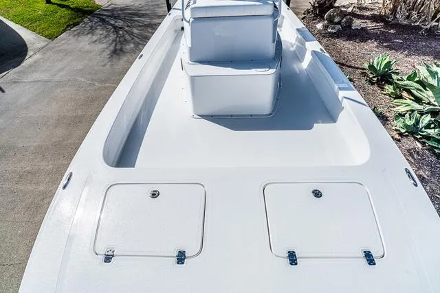Slide: The Image of 2025 Majek 24 Reaper boat deck with storage compartments and seating. - 13
