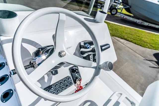 Slide: The Image of Steering wheel of 2025 Majek 24 Reaper boat, showcasing modern controls and sleek design. - 8