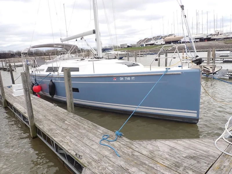 Slide: The Image of 2018 Hanse 348 sailboat docked at a marina with overcast skies. - 3