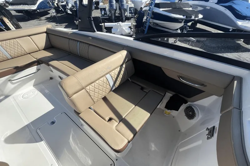 Slide: The Image of 2017 Sea Ray 270SDX boat interior with tan seating and modern design. - 16
