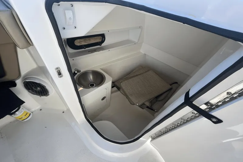 Slide: The Image of Interior of 2017 Sea Ray 270SDX boat with sink and storage area. - 20