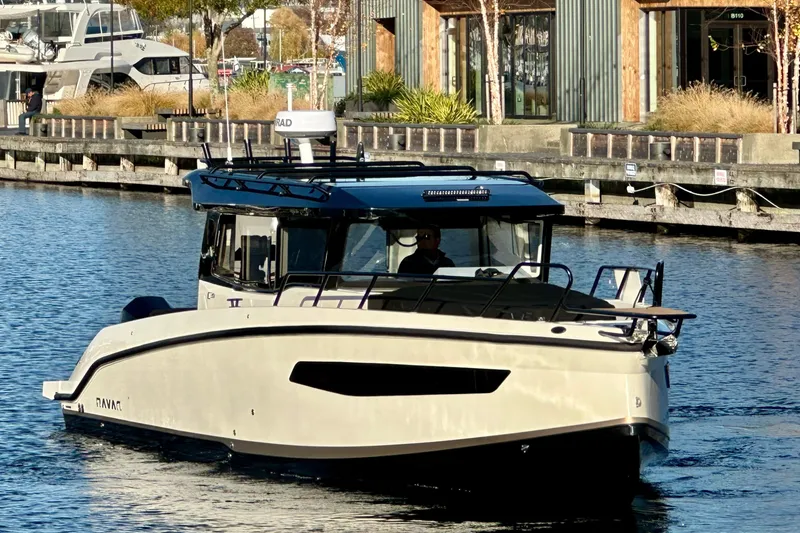 Slide: The Image of Navan C30 2026 boat cruising in a marina, modern design, waterfront background. - 2