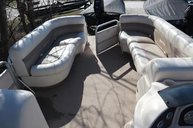 Slide: The Image of 2005 Godfrey Aqua Patio 220 RE pontoon boat interior with plush seating and open layout. - 12