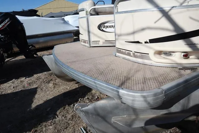 Slide: The Image of 2005 Godfrey Aqua Patio 220 RE pontoon boat, close-up of deck and railing. - 14