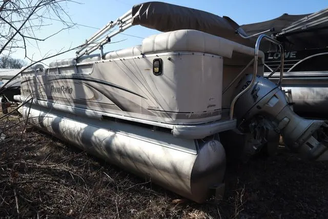 Slide: The Image of 2005 Godfrey Aqua Patio 220 RE pontoon boat in storage, side view. - 15