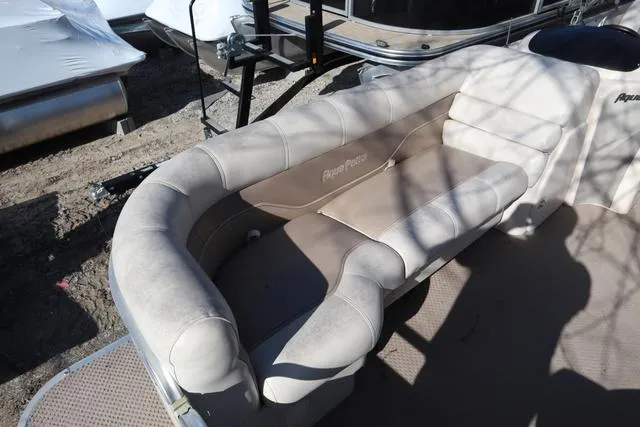 Slide: The Image of 2005 Godfrey Aqua Patio 220 RE boat seating area with beige upholstery. - 3
