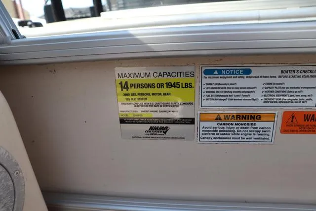 Slide: The Image of Capacity and safety labels on a 2005 Godfrey Aqua Patio 220 re boat. - 9