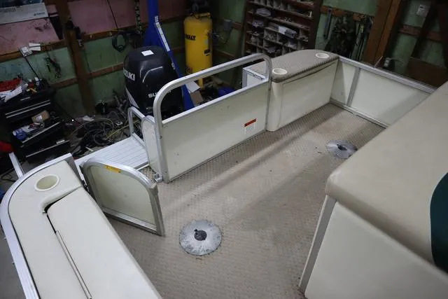 Slide: The Image of 2002 Bennington 2275 FSI boat interior with open deck and seating area. - 14