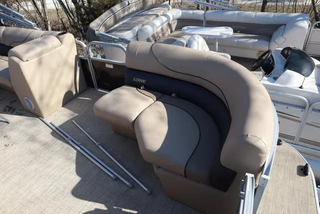 Slide: The Image of 2020 Lowe SS 210 V pontoon boat with beige seating and spacious deck layout. - 12