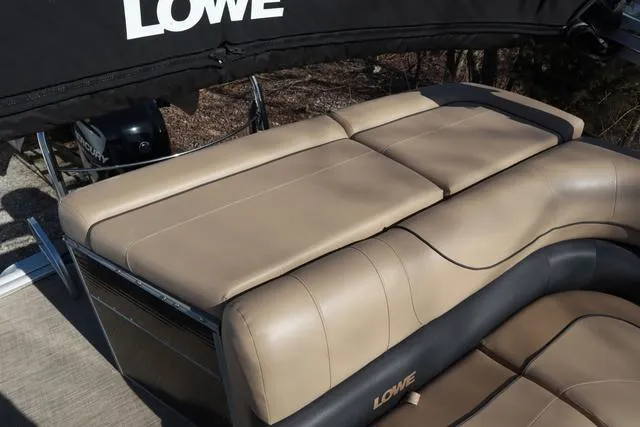 Slide: The Image of 2020 Lowe SS 210 V boat with tan leather seating and black canopy. - 14