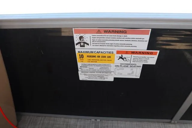 Slide: The Image of Warning label on 2020 Lowe SS 210 V boat, showing maximum capacity of 10 persons or 1500 lbs. - 8