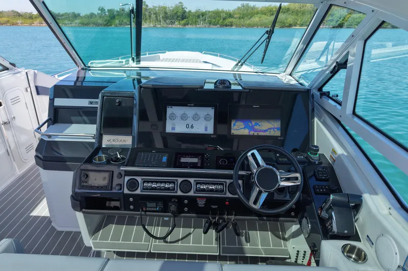 Slide: The Image of 2024 Formula 430 SSC helm with advanced navigation and control systems on a sunny day. - 10