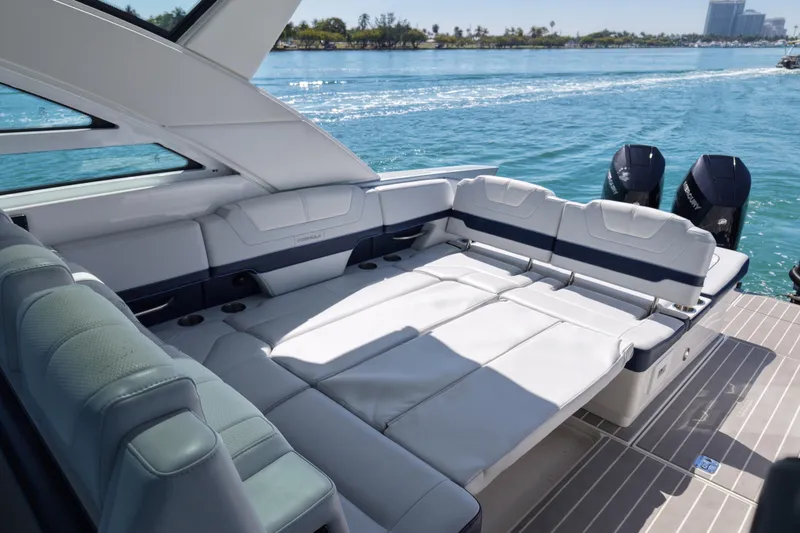 Slide: The Image of 2024 Formula 430 SSC luxury boat interior with spacious seating and scenic water view. - 13