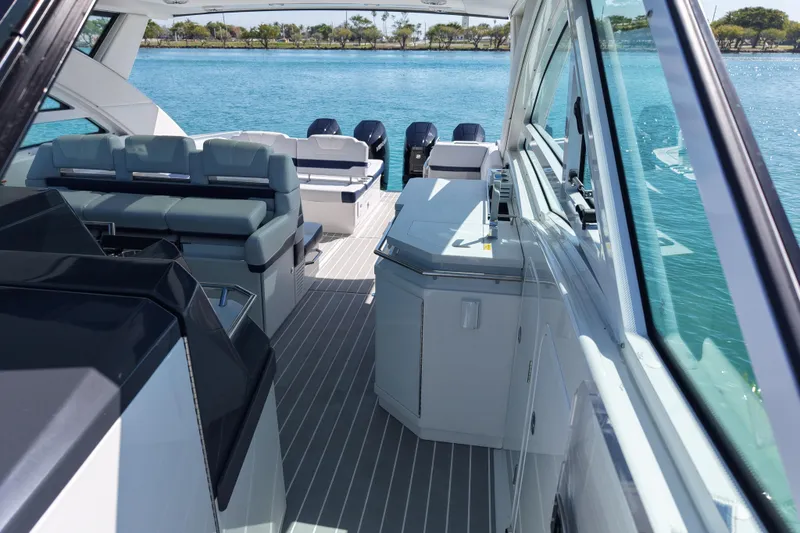 Slide: The Image of 2024 Formula 430 SSC luxury boat interior with seating and water view. - 14