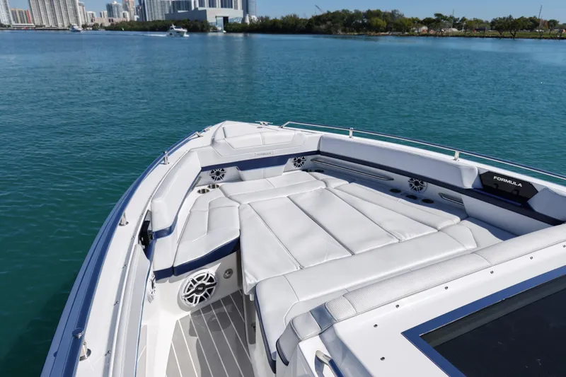 Slide: The Image of 2024 Formula 430 SSC luxury boat with spacious seating on calm water. - 15