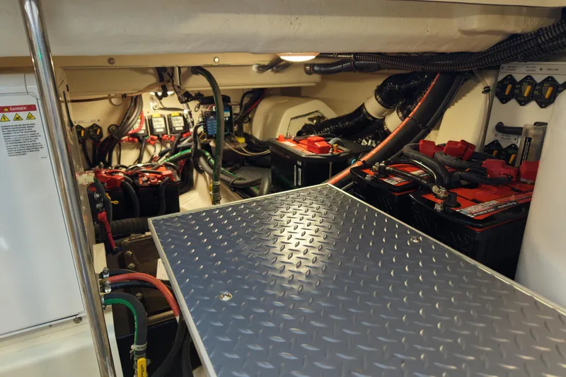 Slide: The Image of Engine room of 2024 Formula 430 SSC, featuring batteries and wiring components. - 24