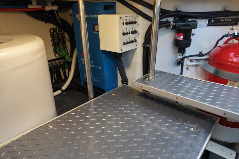 Slide: The Image of Engine room of 2024 Formula 430 SSC with control panel and fire extinguisher. - 25