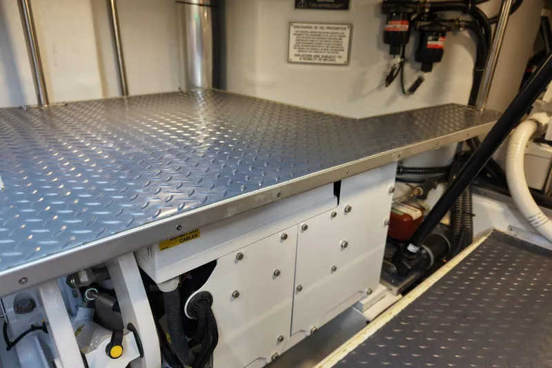 Slide: The Image of Engine room of 2024 Formula 430 SSC with metallic flooring and equipment. - 27