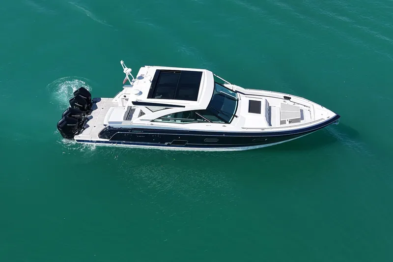 Slide: The Image of 2024 Formula 430 SSC luxury boat cruising on turquoise water. - 6