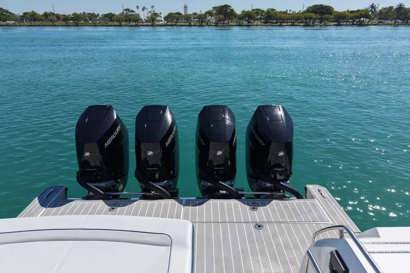 Slide: The Image of 2024 Formula 430 SSC boat with four Mercury outboard engines on a serene water backdrop. - 9