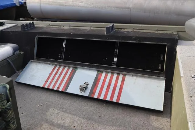 Slide: The Image of Open storage compartment on a 1984 Monark 1648 SC boat. - 10