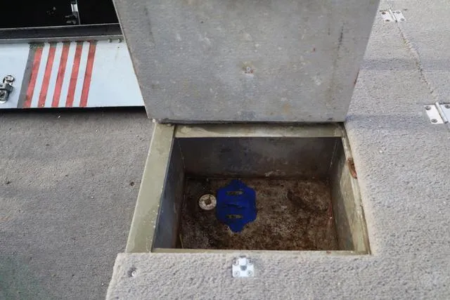 Slide: The Image of Open storage compartment on 1984 Monark 1648 SC boat deck. - 11