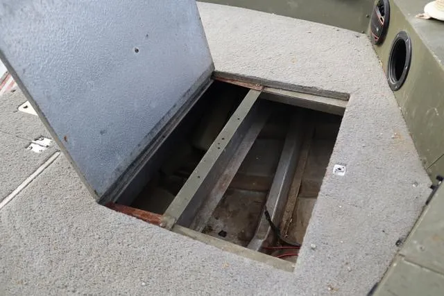 Slide: The Image of Open storage compartment on 1984 Monark 1648 SC boat deck. - 12