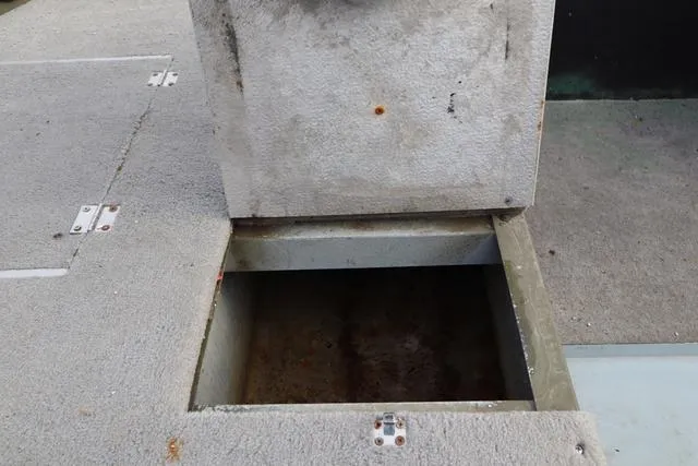 Slide: The Image of Open storage compartment on 1984 Monark 1648 SC boat deck. - 15