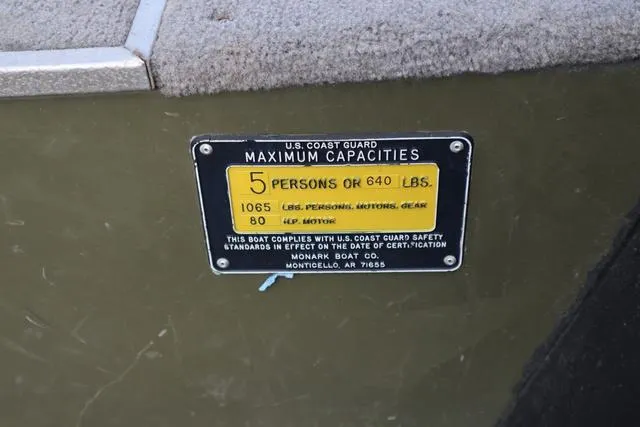 Slide: The Image of 1984 Monark 1648 SC capacity plate, 5 persons or 640 lbs, U.S. Coast Guard compliant. - 16