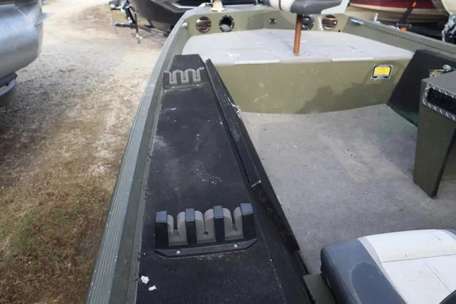 Slide: The Image of 1984 Monark 1648 SC boat interior with seating and storage compartments. - 8