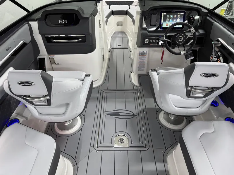 Slide: The Image of 2025 Chaparral 2870 SSX boat interior with modern dashboard and seating. - 14