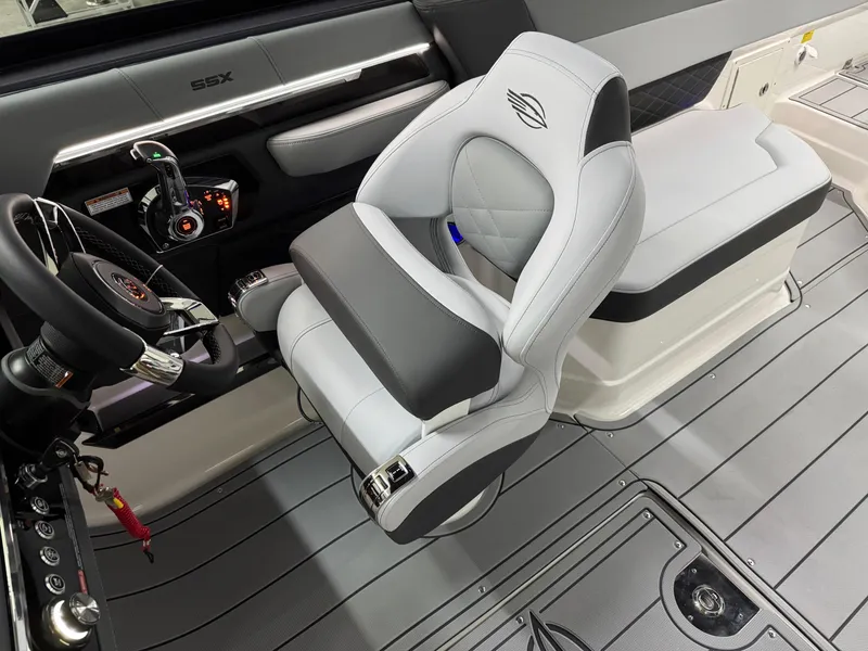 Slide: The Image of 2025 Chaparral 2870 SSX boat interior with modern steering and luxurious seating. - 18