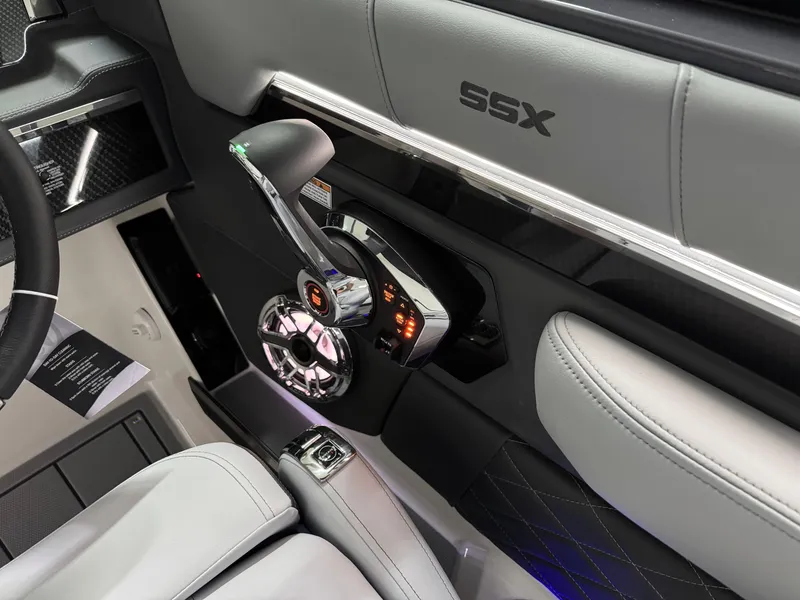 Slide: The Image of Interior of 2025 Chaparral 2870 SSX boat, featuring sleek controls and luxurious seating. - 19
