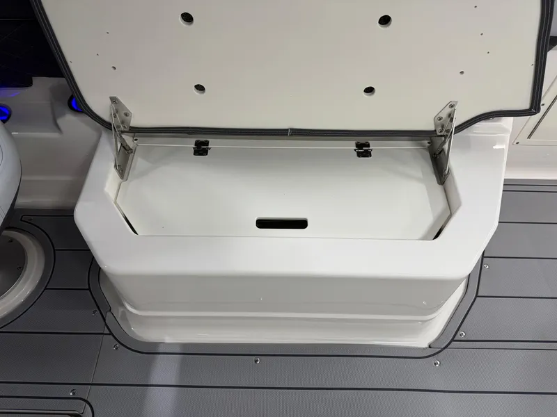 Slide: The Image of Open storage compartment on 2025 Chaparral 2870 SSX boat deck. - 27