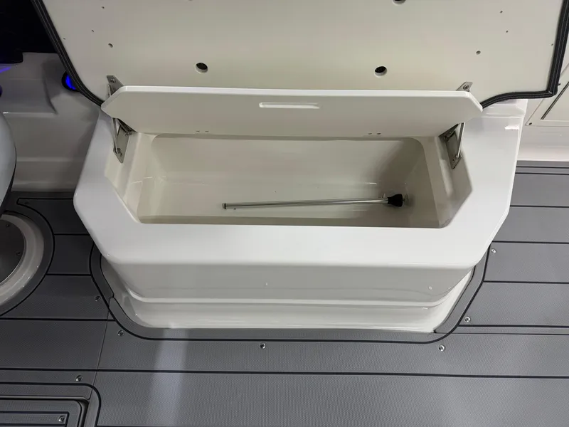 Slide: The Image of Open storage compartment on 2025 Chaparral 2870 SSX boat, featuring sleek design and durable materials. - 28