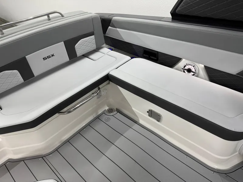 Slide: The Image of 2025 Chaparral 2870 SSX boat interior with gray seating and sleek design. - 29