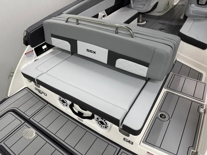 Slide: The Image of 2025 Chaparral 2870 SSX boat interior with gray seating and modern design. - 3