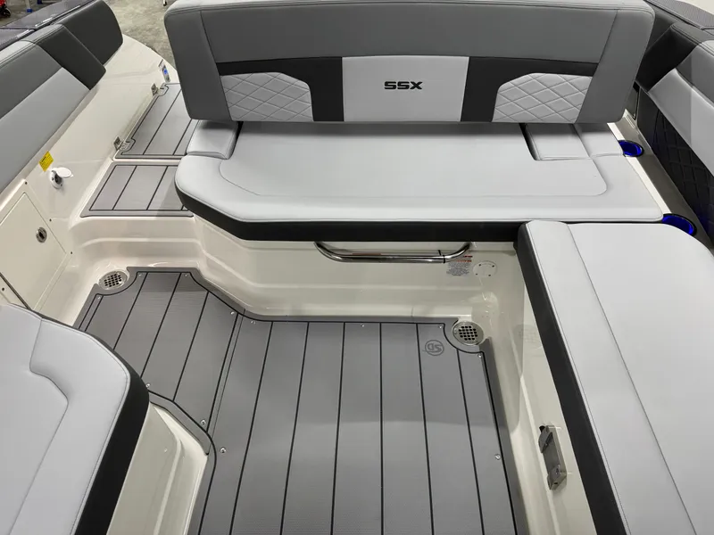 Slide: The Image of 2025 Chaparral 2870 SSX boat interior with gray seating and flooring. - 30