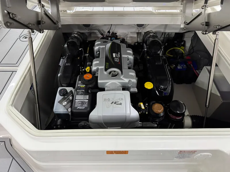 Slide: The Image of Engine compartment of 2025 Chaparral 2870 SSX boat, showcasing powerful motor components. - 31