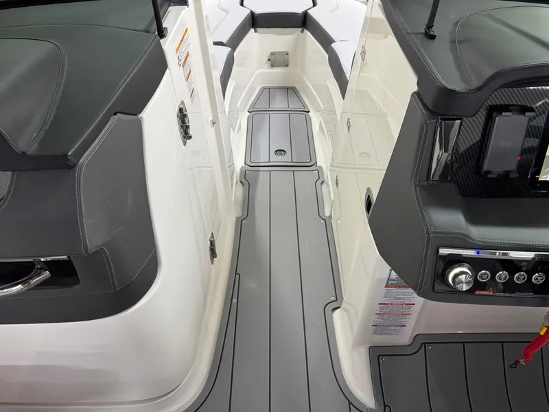 Slide: The Image of Interior view of 2025 Chaparral 2870 SSX boat, featuring sleek seating and modern dashboard controls. - 32
