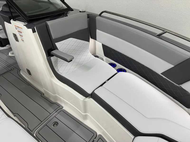 Slide: The Image of 2025 Chaparral 2870 SSX boat interior with sleek gray and white seating design. - 38