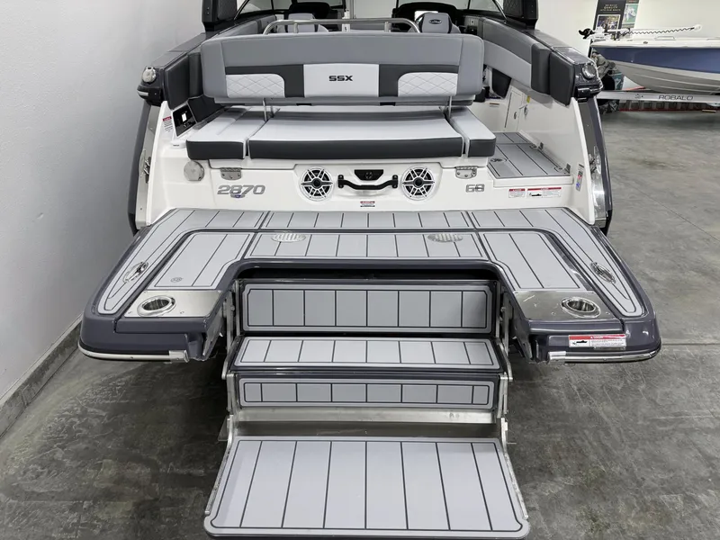 Slide: The Image of 2025 Chaparral 2870 SSX boat with sleek gray deck and seating. - 8