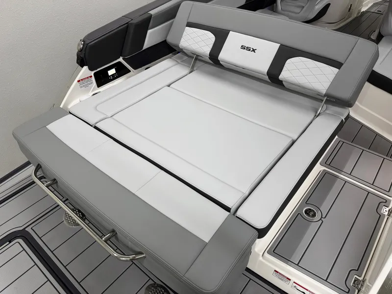 Slide: The Image of 2025 Chaparral 2870 SSX boat interior with gray cushioned seating and sleek design. - 9