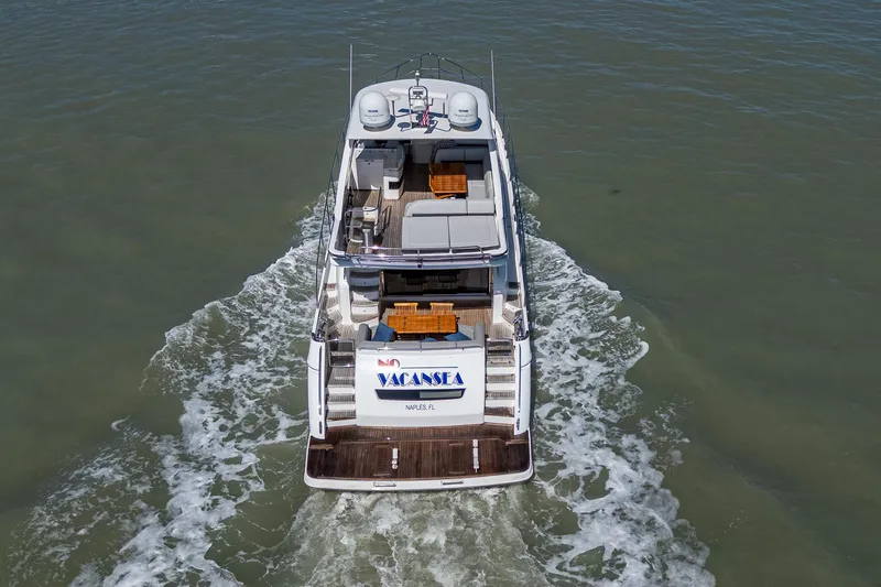 Slide: The Image of 2016 Princess Flybridge 64 Motor Yacht cruising on open water. - 14