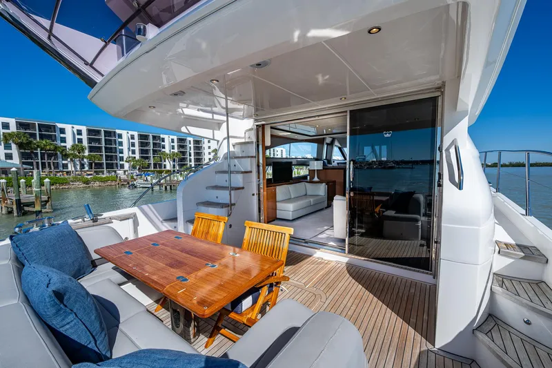 Slide: The Image of 2016 Princess Flybridge 64 Motor Yacht with outdoor seating and luxurious interior. - 27